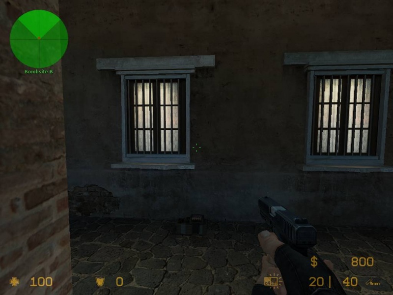 This position gives you a bit more cover and still keeps everything but the library in play as bomb coverage options, but does not take out the CT spawn side of the bombsite completely out of the equation.
